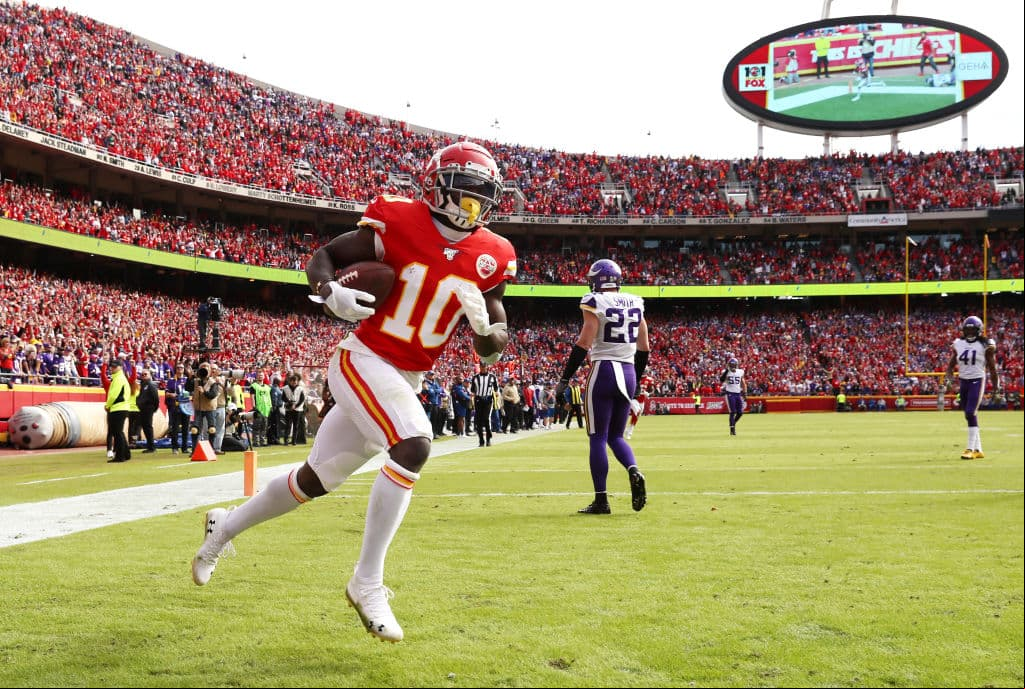 KANSAS CITY, MISSOURI - NOVEMBER 03: Tyreek Hill #10 of the Kansas City Chiefs celebrates catching a 40-yard touchdown  against the Minnesota Vikings during the first quarter at Arrowhead Stadium on November 03, 2019 in Kansas City, Missouri. (Photo by Jamie Squire/Getty Images)