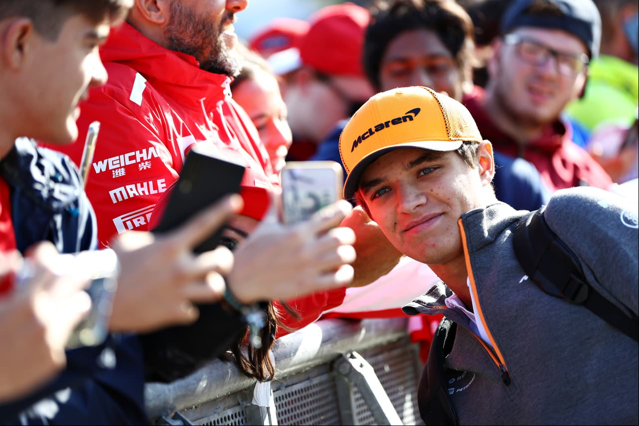 MONZA, ITALY - SEPTEMBER 08: Lando Norris of Great Britain and McLaren F1 arrives at the circuit and greets fans before the F1 Grand Prix of Italy at Autodromo di Monza on September 08, 2019 in Monza, Italy. (Photo by Mark Thompson/Getty Images)